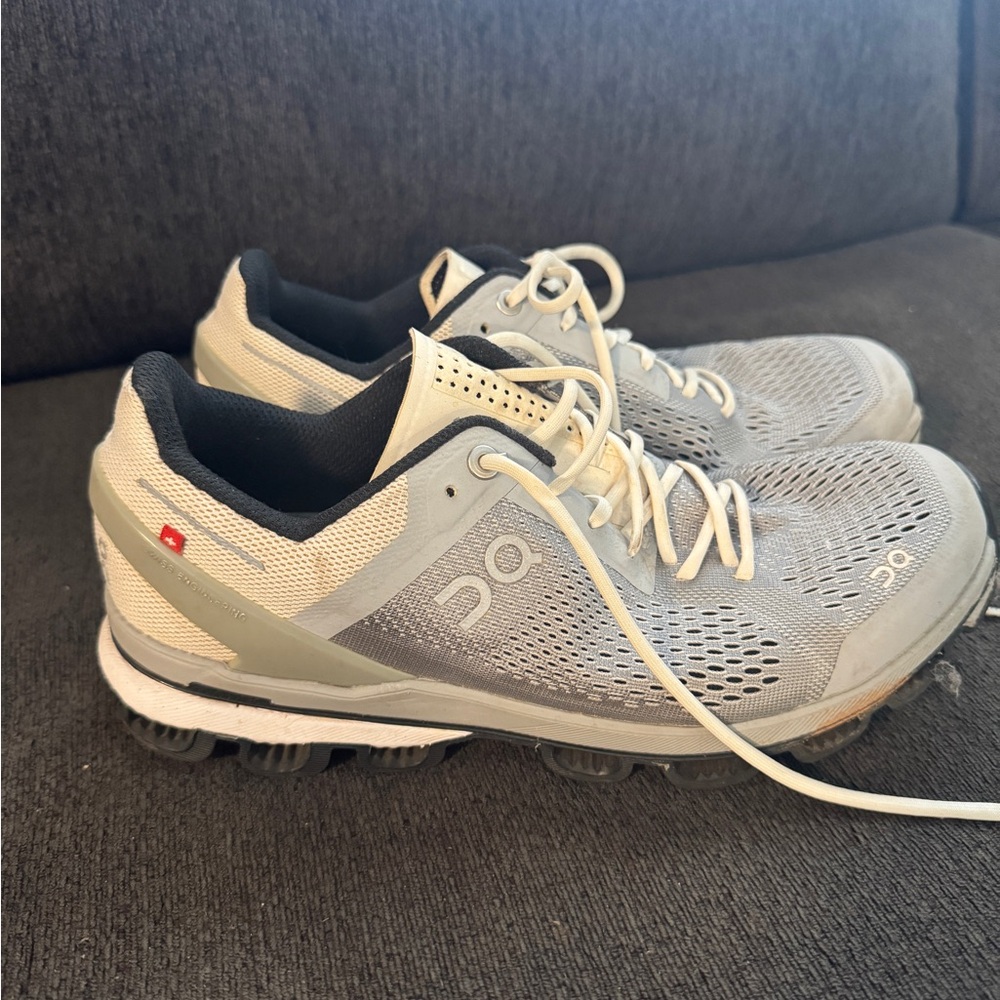 On Running Gray and White Athletic Shoes with Cloud Cushioning